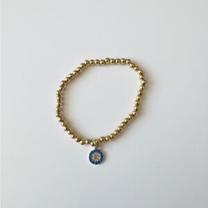 Gold Beaded Bracelet with Blue Charm